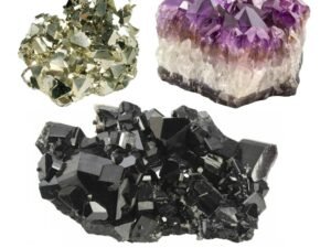 riple action abundance manifestation kit featuring raw pyrite, deep purple amethyst, and black tourmaline clusters on a natural wooden tray.